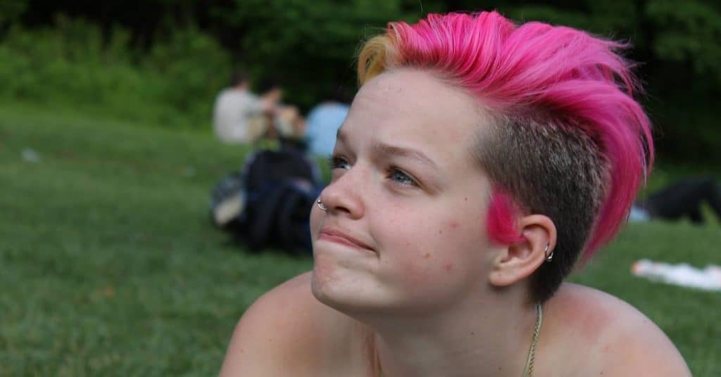 Alma with her pink hair at camp