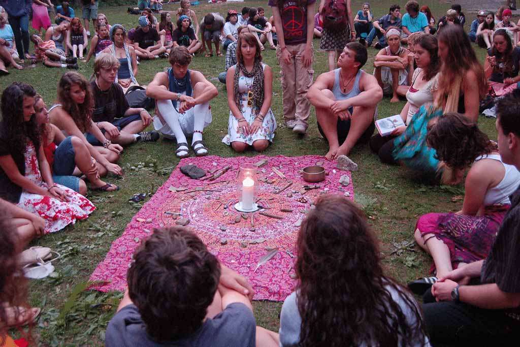 Campers gather outdoors for crystal meditation ceremony.