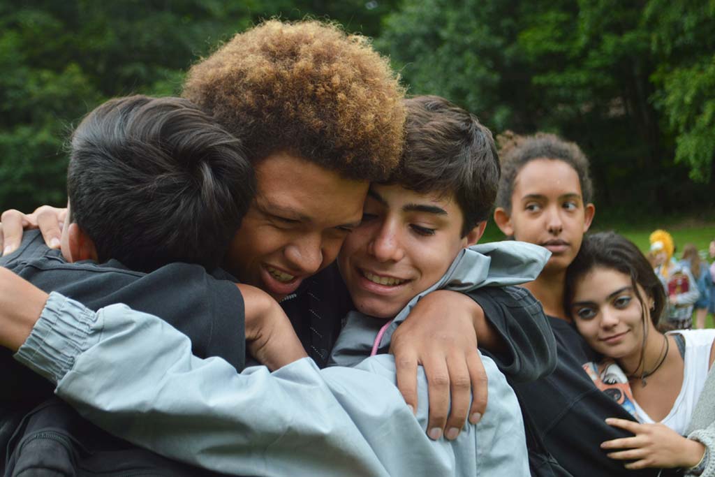 Campers hugging goodbye