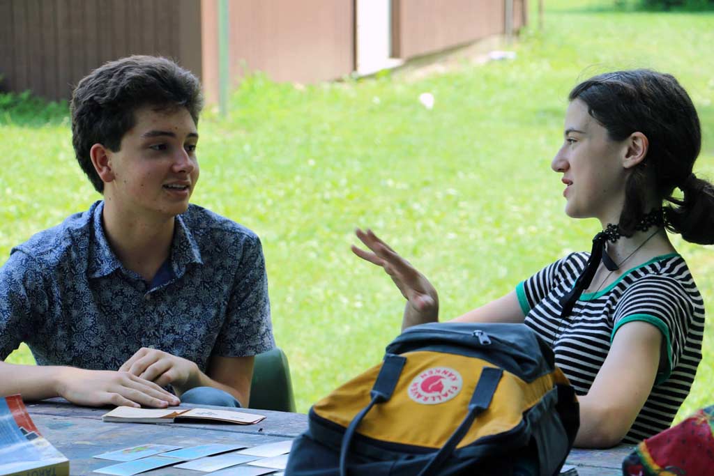 Two teens engaged in discussion