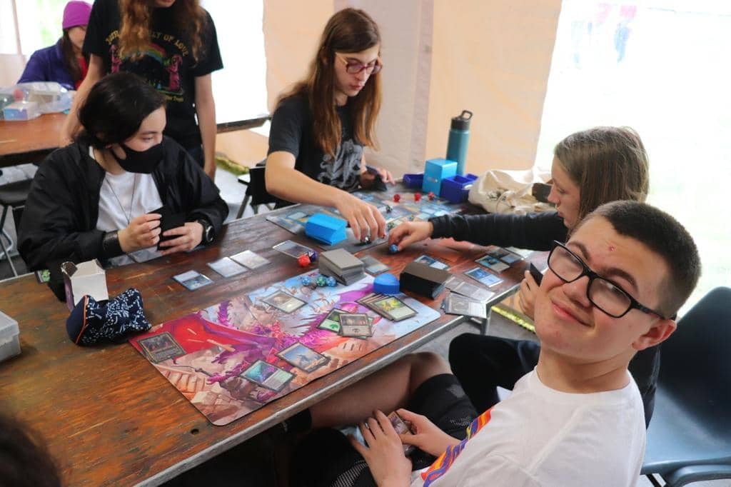 Teens play Magic: The Gathering