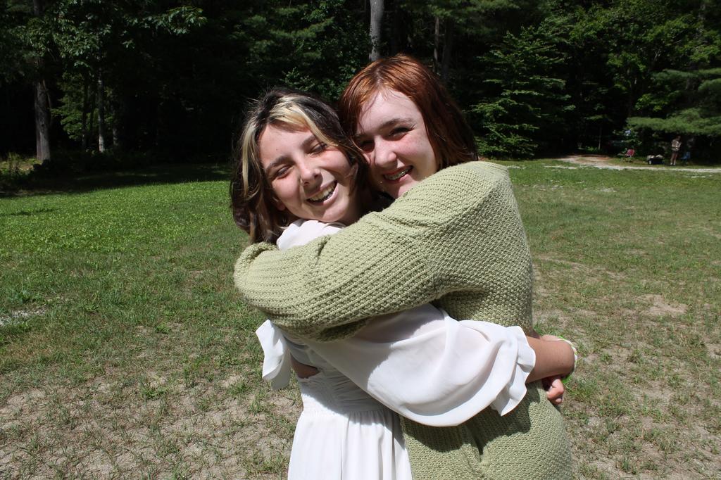 Happy campers hugging