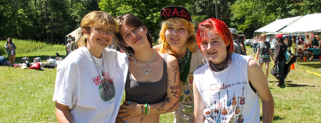 Three teens pose for a photo